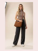 CrossKulture - BlissLuxe brown lightweight handbag carried by female model