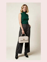 CrossKulture - BlissPearl white lightweight handbag carried by female model