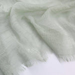 CrossKulture - MintyHue crinkle scarf on white surface