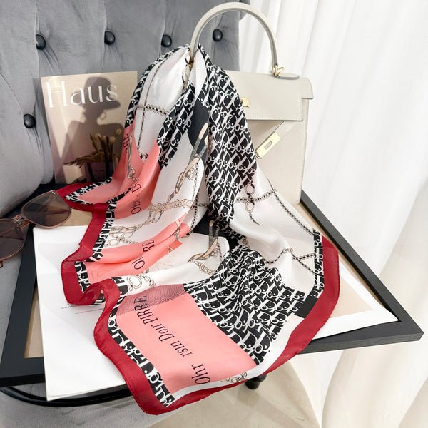 CrossKulture - GlossyPop Small Square Satin Scarf Red placed on a bag view