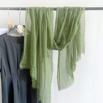 CrossKulture - OilveOil Green Crinkled Cotton Scarf hanging on a handle view