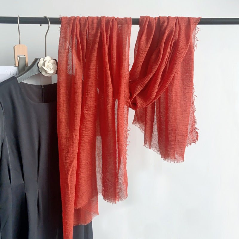 CrossKulture - RustTint Rust Crinkled Cotton Scarf hanging on a handle view