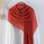 CrossKulture - RustTint Rust Crinkled Cotton Scarf styled on a hanger view