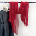 CrossKulture - RedFlag Red Crinkled Cotton Scarf hanging on a handle view
