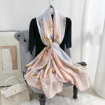 CrossKulture - DawnsEmbrace Long Satin Scarf Peach styled on hanger view