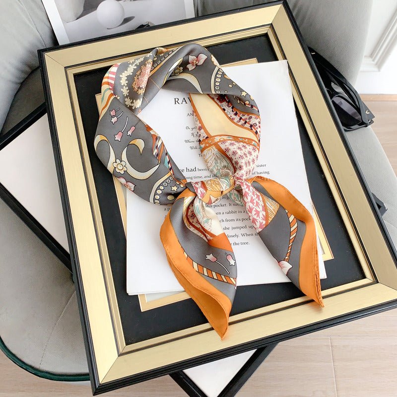 CrossKulture - SmokyBlaze Small Square Satin Scarf Orange placed on a frame view