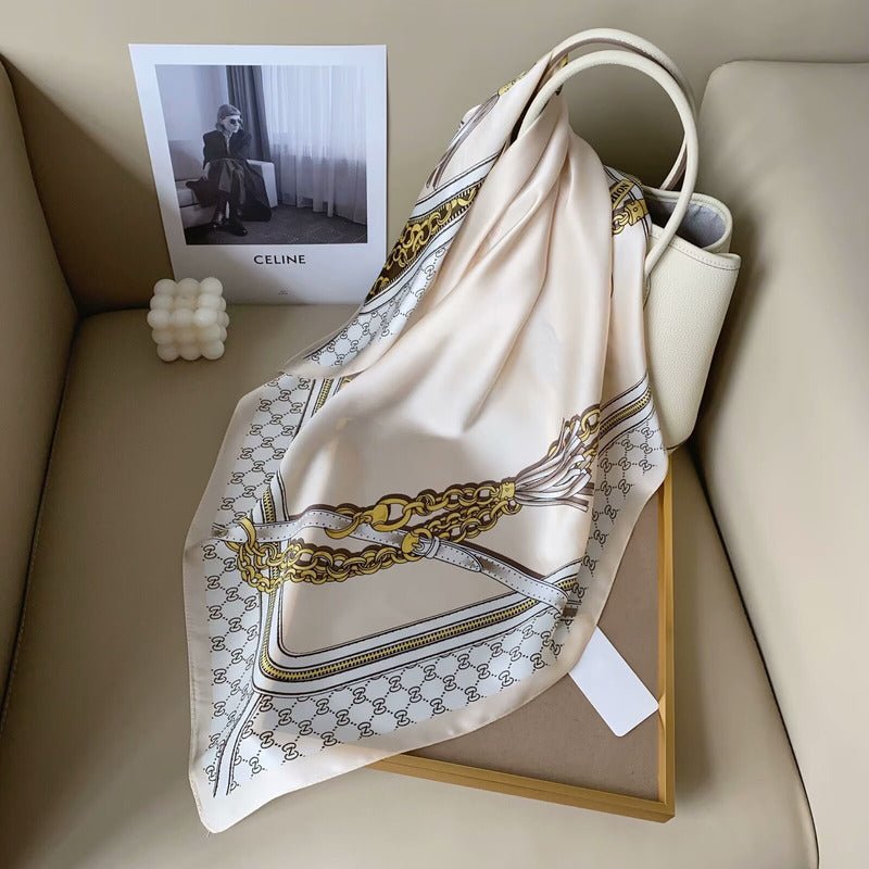 CrossKulture - SatinCreme Small Square Satin Scarf Offwhite placed on a bag view
