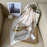 CrossKulture - SatinCreme Small Square Satin Scarf Offwhite placed on a bag view