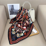 CrossKulture - BusyColours Small Square Satin Scarf Black placed on a bag view