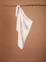 CrossKulture - SereneHorizon Small Square Satin Scarf Blue hanging on handle bar