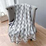 CrossKulture - FloralCrossing Viscose Cotton Scarf White placed on a sofa view