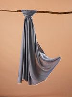 CrossKulture - DenimDriftwood Modal Reversible Stole Blue hanging on a handle bar