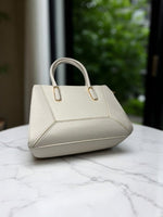 CrossKulture - BlissChic lightweight white handbag placed on a table