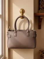 CrossKulture - BlissIcon arm two front pocket beige handbag back view