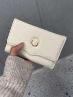 CrossKulture - PearlClutch lightweight clutch bag front view in model hands