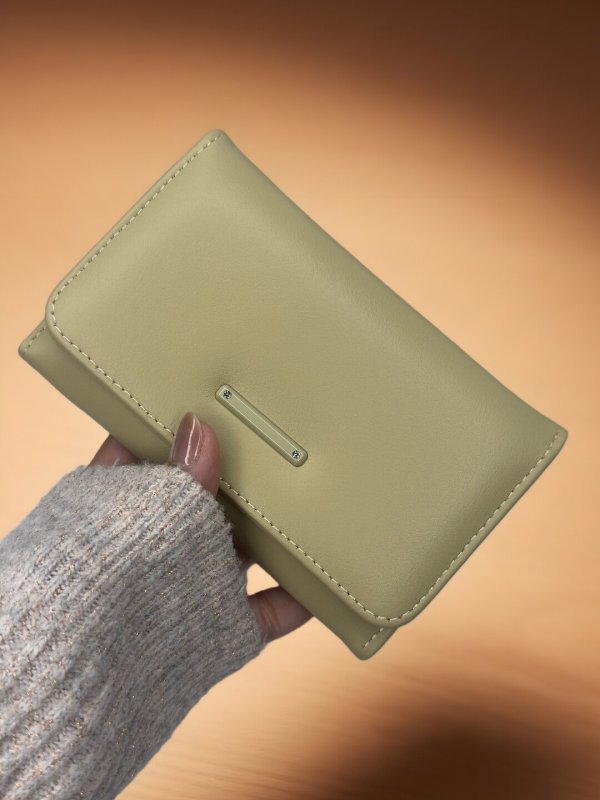 CrossKulture - SageClutch lightweight clutch bag front view in model hands