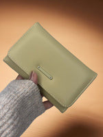 CrossKulture - SageClutch lightweight clutch bag front view in model hands