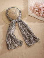 CrossKulture - AcaciaBloom Floral Print Poly Cotton Scarf Grey placed a on a hat view