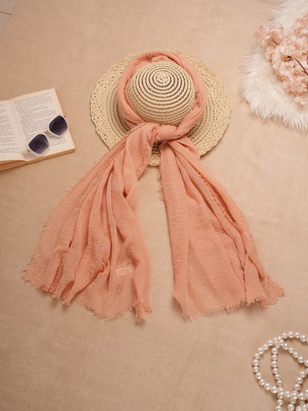CrossKulture - SoftApricot Light Coral Crinkled Cotton Scarf style on a hat view