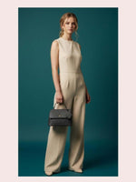 CrossKulture - BlissSelect black lightweight handbag carried by female model