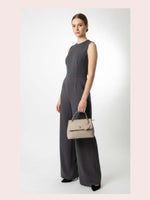 CrossKulture - BlissClass green lightweight handbag carried by female model