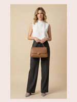 CrossKulture - BlissElite brown lightweight handbag carried by female model