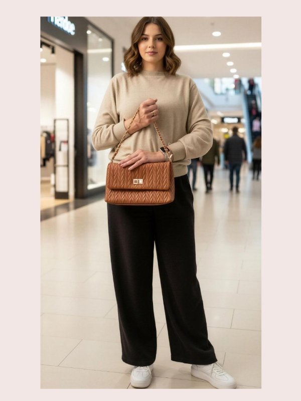 CrossKulture - BlissRadiance brown lightweight handbag carried by female model