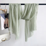CrossKulture - MintyHue crinkle scarf hanging on a handle bar