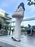 CrossKulture - ExpanseTrendy Tote Bag front view with model showing straps