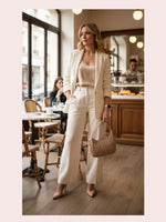 CrossKulture - BlissPoise beige lightweight handbag carried by female model