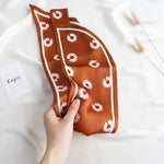 CrossKulture - BrickFlora satin neck scarf in model hands
