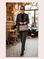 CrossKulture - BlissVogue taupe lightweight handbag carried by female model