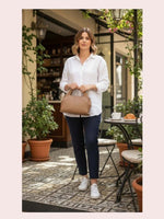 CrossKulture - BlissAura brown lightweight handbag carried by female model