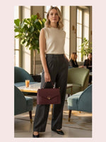 CrossKulture - BlissEffect brown lightweight handbag carried by female model