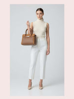 CrossKulture - BlissEdit brown lightweight handbag carried by female model