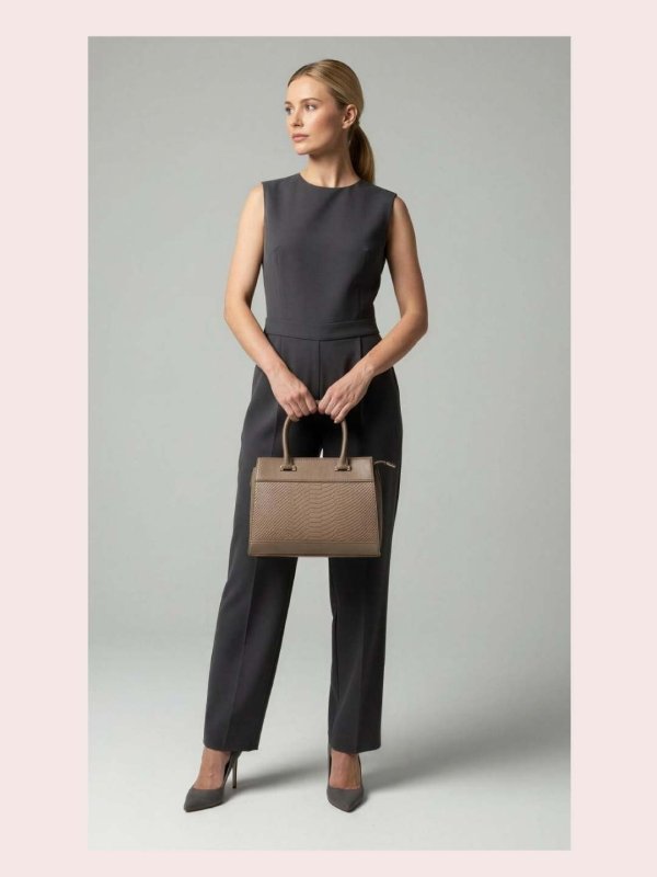 CrossKulture - BlissCarry green lightweight handbag carried by female model