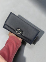CrossKulture -RoyalCarry lightweight long wallet front view in model hand