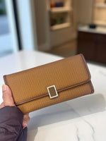 CrossKulture -IconicCarry lightweight long wallet front view in model hand