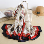 CrossKulture - RoyalChariot Long Satin Scarf Creme placed on a bag view