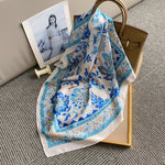 CrossKulture - AquaSpring Small Square Satin Scarf Blue tied placed on a bag view