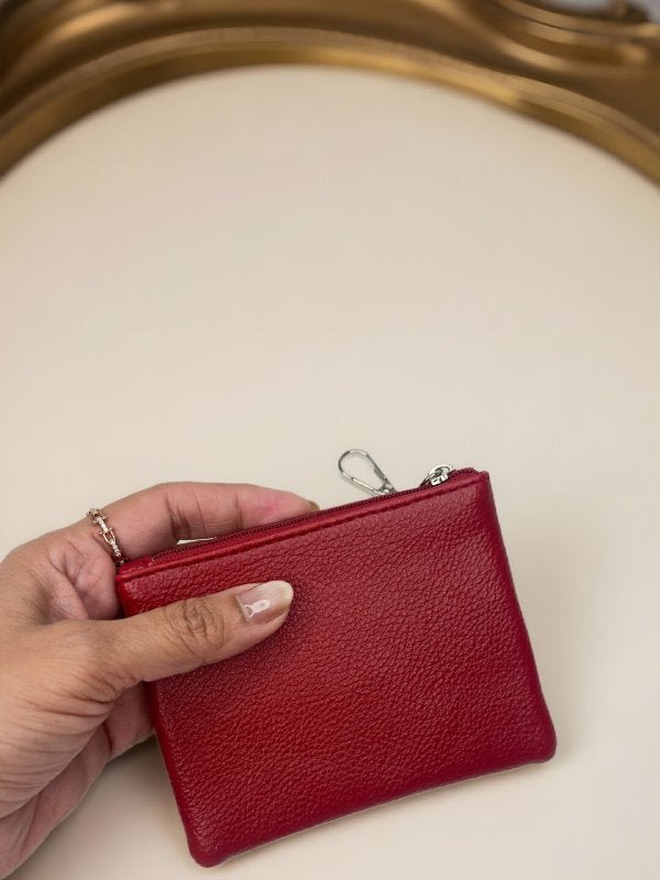 CrossKulture - GlamVault lightweight coin purse front view with model hand