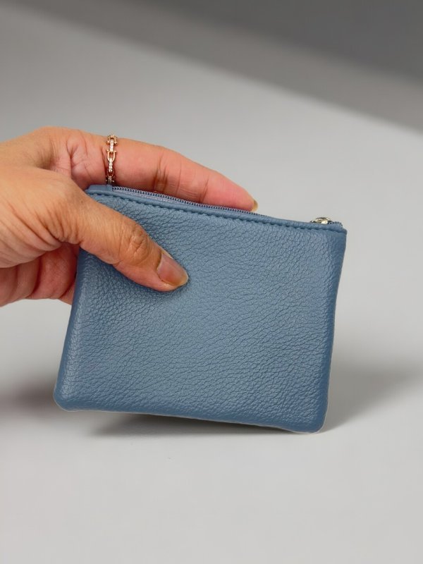 CrossKulture - GlamHolder lightweight coin purse front view with model hand