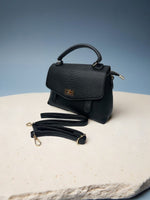 CrossKulture - BlissPulse lightweight black handbag side view showing long strap