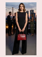 CrossKulture - BlissMode red lightweight handbag carried by female model