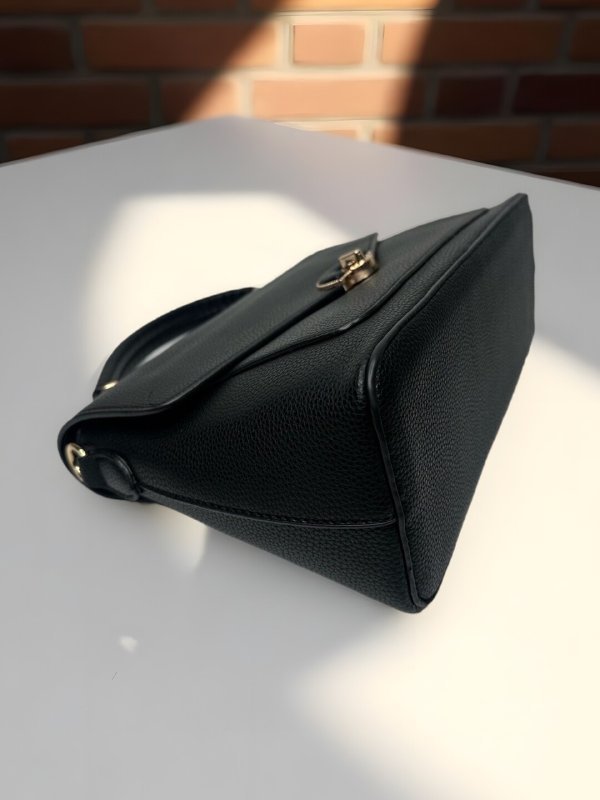 CrossKulture - BlissNoir lightweight black handbag placed on a table