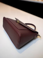 CrossKulture - BlissEffect lightweight brown handbag placed on a table