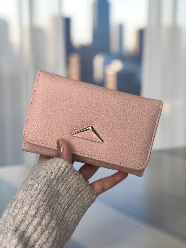 CrossKulture - BlushClutch lightweight clutch bag front view in model hands