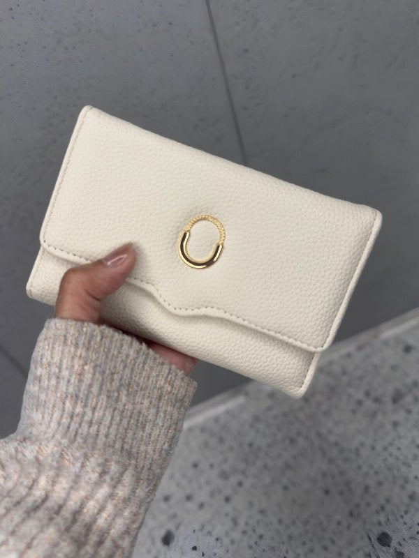CrossKulture - PearlClutch lightweight clutch bag front view in model hands
