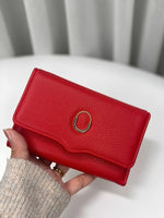 CrossKulture - CrimsonClutch lightweight clutch bag front view in model hands